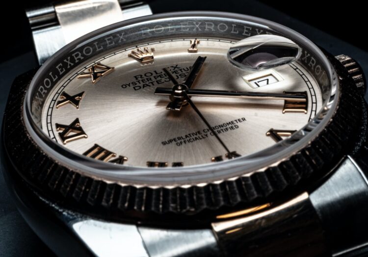 close up photo of round analog watch